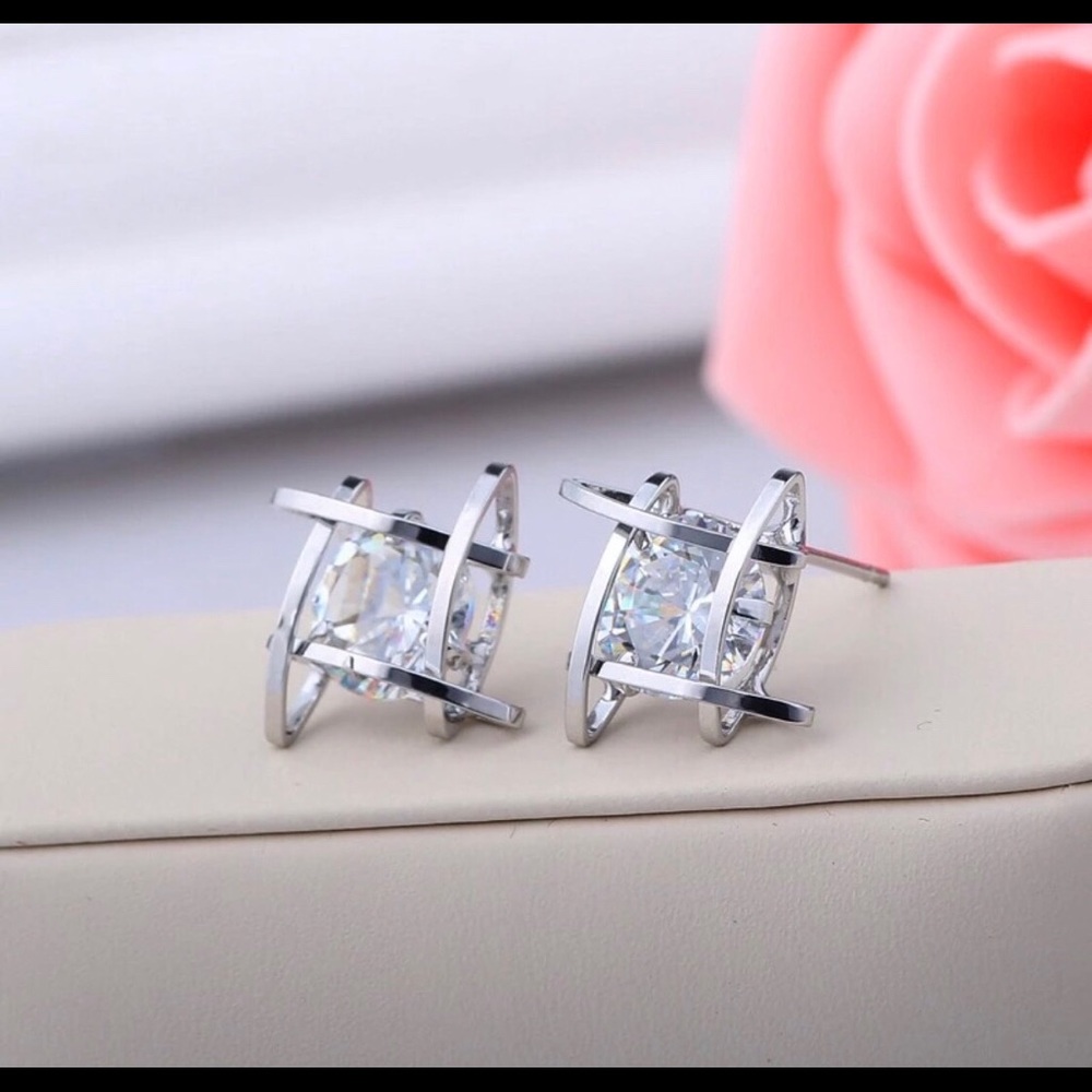 Square silver tone earrings with crystal stone